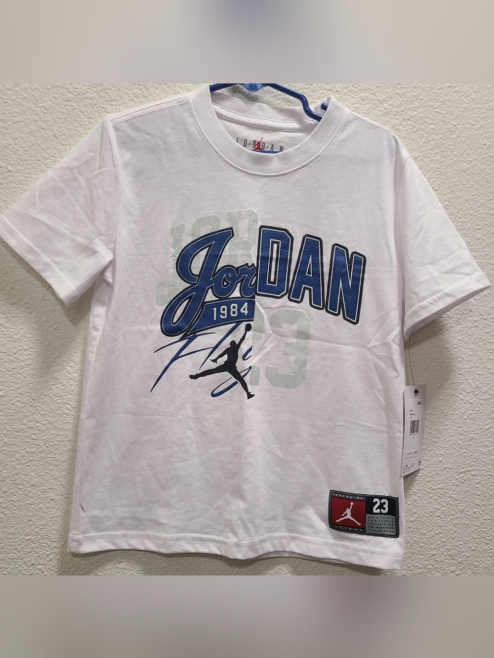 Jordan White Short Sleeve Tee with Blue Logo and Black Jumpman